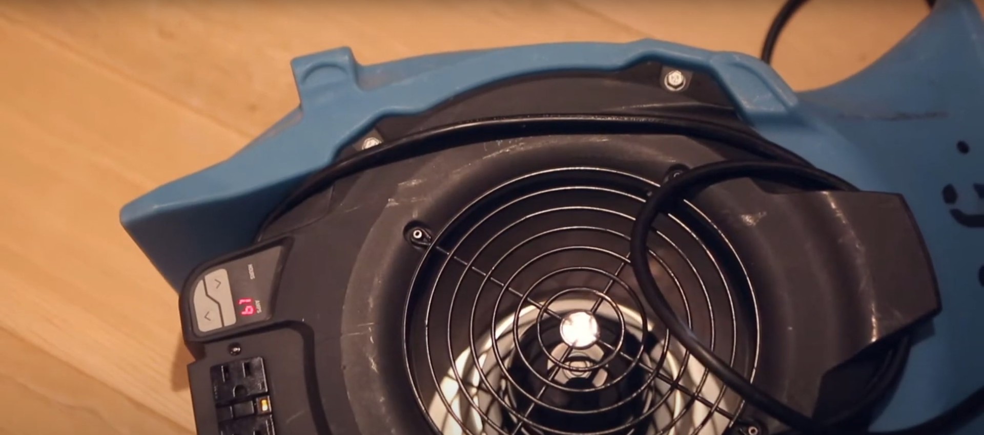 Professional water damage restoration equipment including industrial fans and air movers